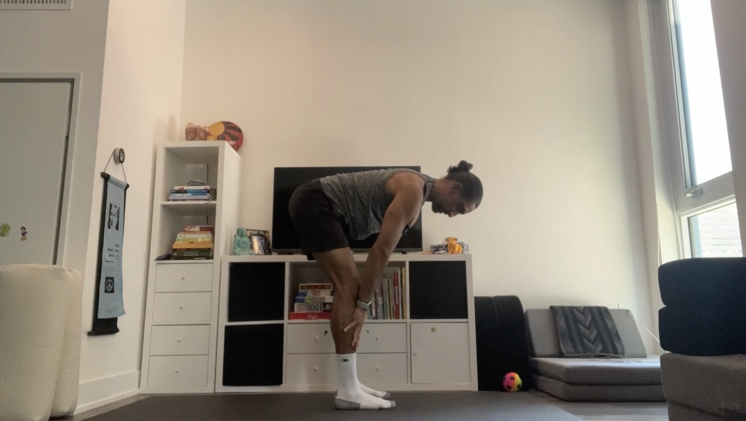 Yoga teacher Jaffer Hussain in Halfway Lift, part of his yoga for tech neck practice
